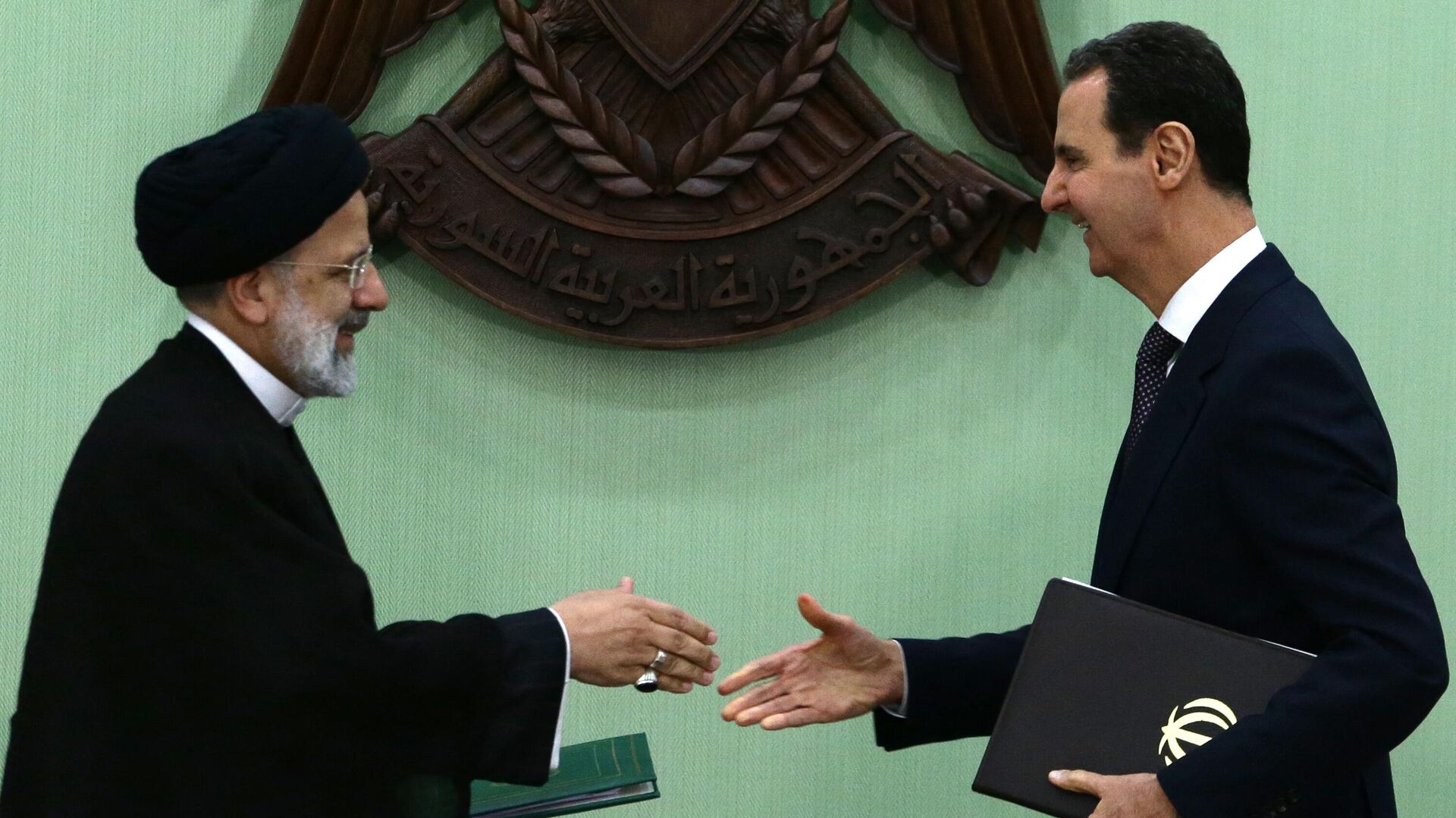 الاسد ورئيسي